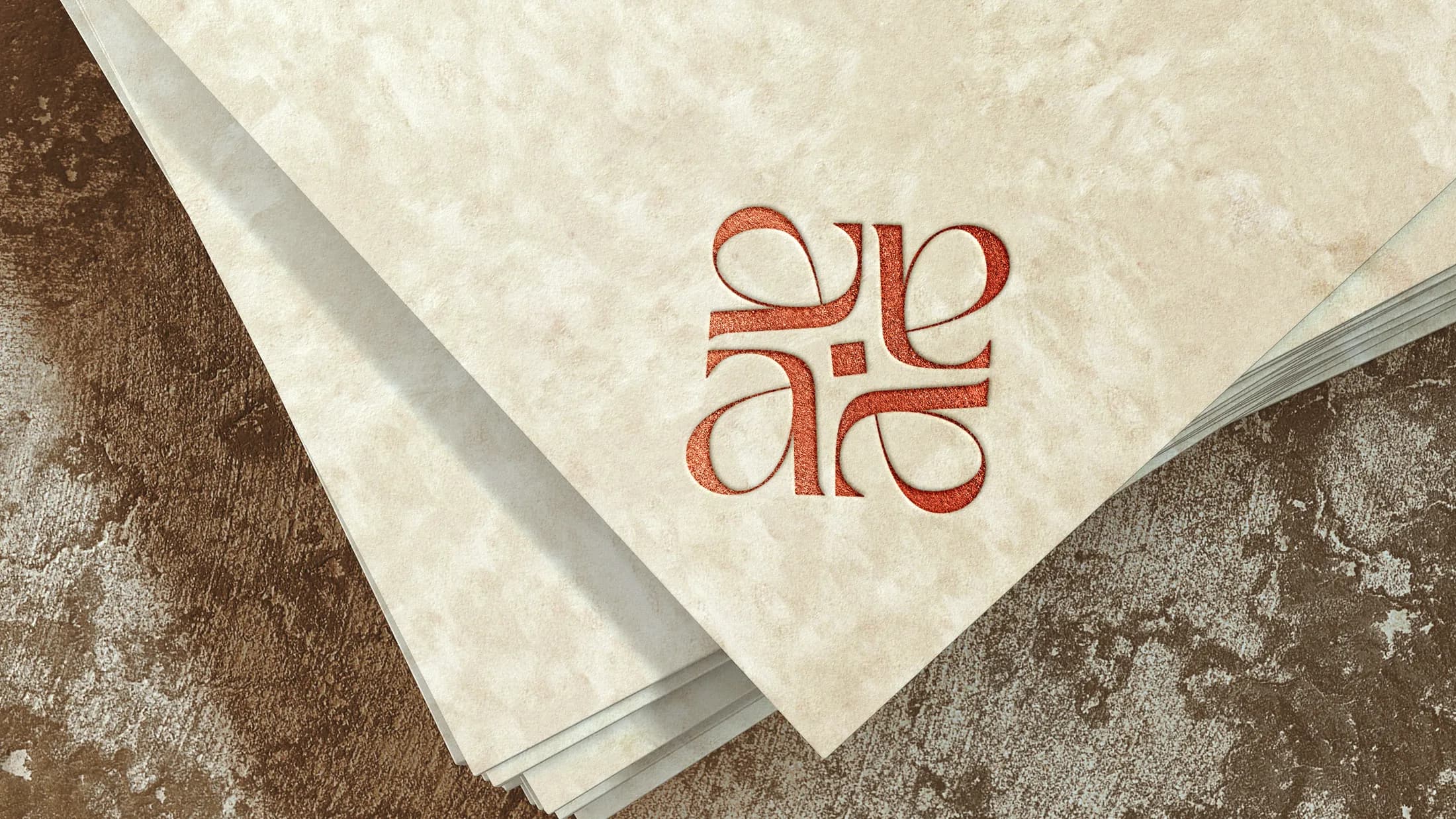 The motif letterpressed into textured paper