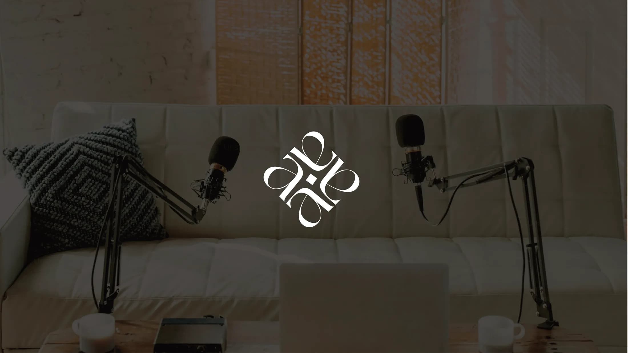The monogram over a podcast recording corner