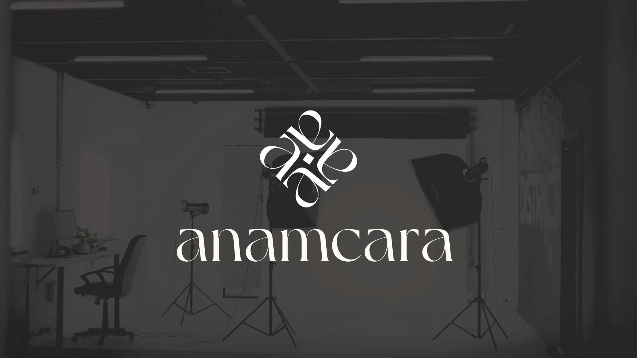 White Anamcara lockup over a dark photography studio