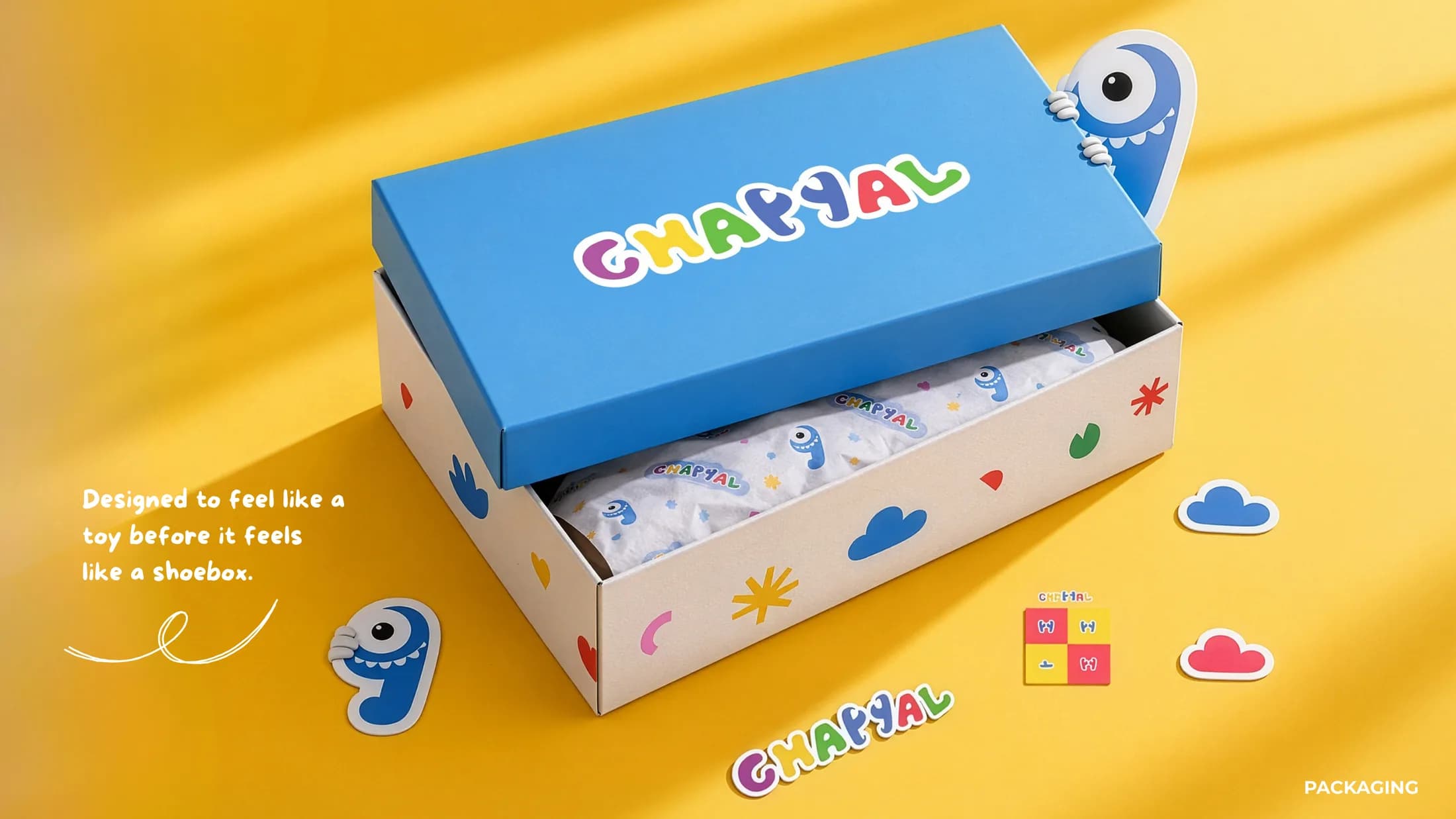 Chappal shoebox in blue and yellow with Piko peeking out